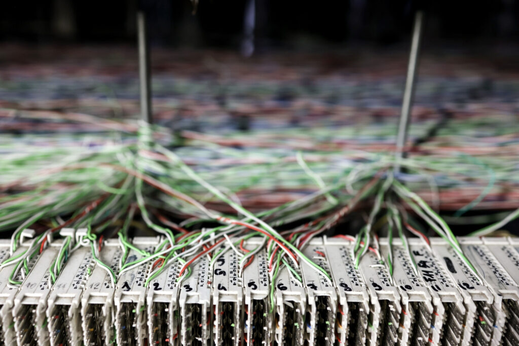 Telecommunication components and wiring inside a Telecom Italia SpA telephone exchange in Rome, Italy, on Tuesday, April 4, 2023. Telecom Italia sold €400 million ($435 million) of bonds as it pushes ahead with the sale of its landline network in a bid to slash the company’s debt pile after interest rates rose. Photographer: Alessia Pierdomenico/Bloomberg